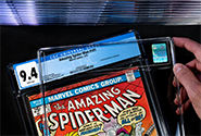 A CGC representative inserts a comic book and its label into CGC’s archival holder during the CGC encapsulation process.